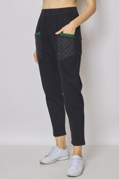 Black jeans with checkerboard pattern pockets