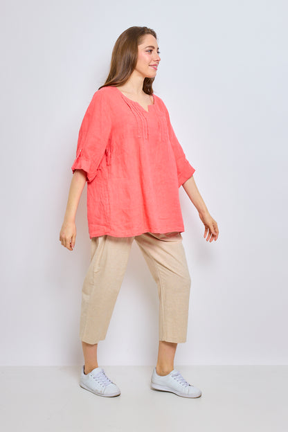 Linen top with inverted V-neck and embroidered trim