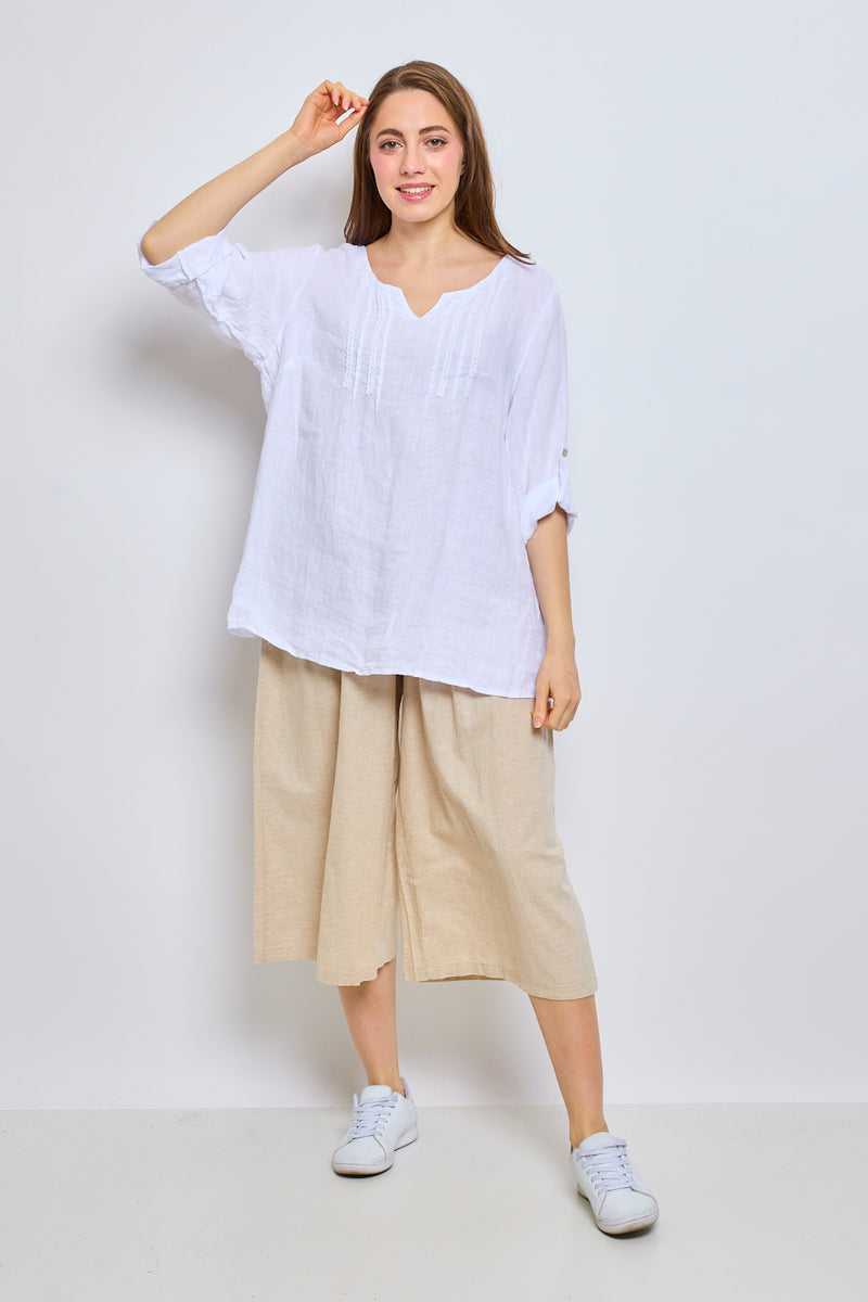 Top en lin avec col en V inversé et garniture brodée