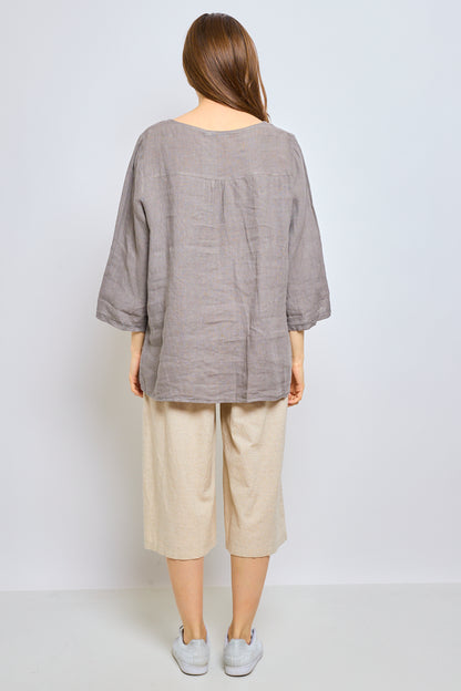 Linen top with inverted V-neck and embroidered trim