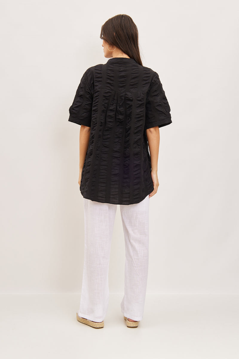 Blouse asymétrique à plis