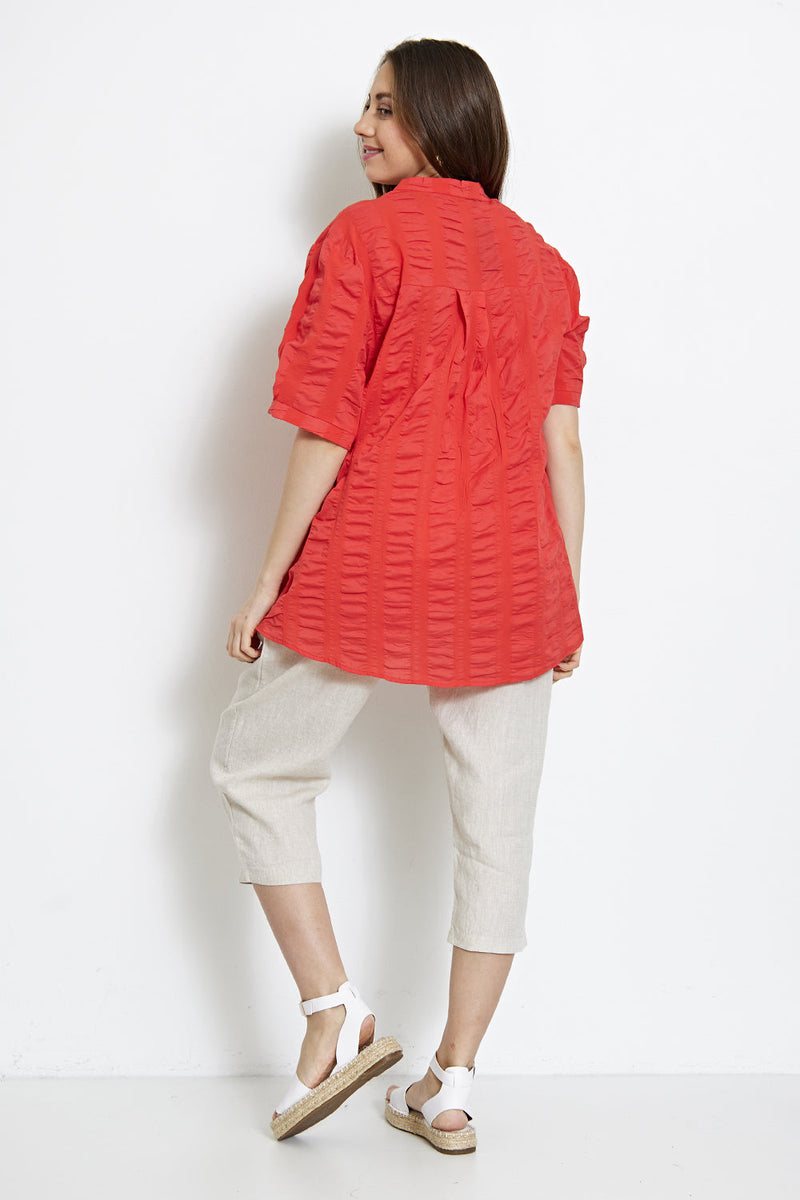 Blouse asymétrique à plis