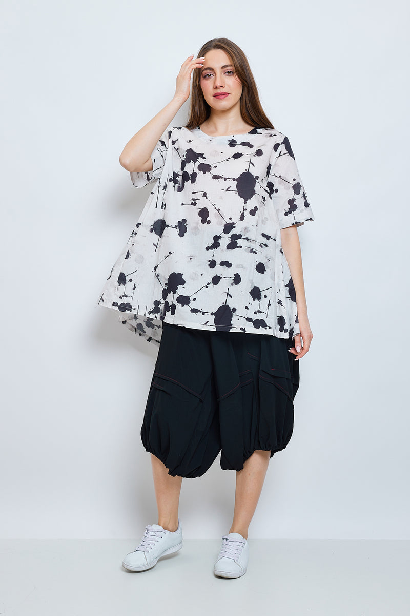 Haut blanc à effet tacheté noir