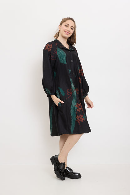 Coat with green shapes and red sharps