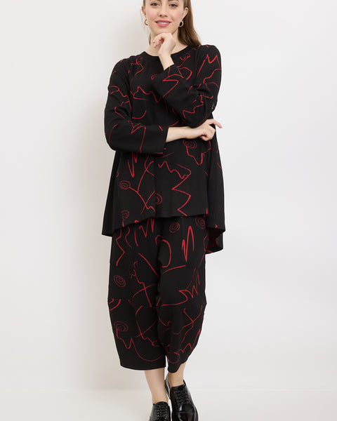 Pantalon à traits et spirales fantaisistes