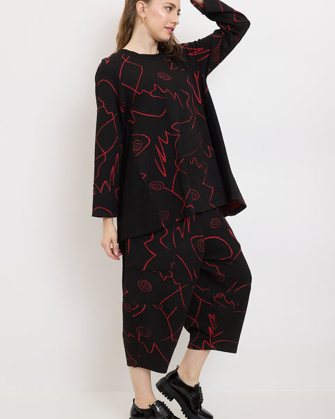 Pantalon à traits et spirales fantaisistes